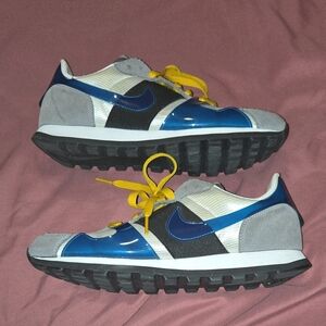 Nike Blue and Gray Sneakers with Yellow Accents